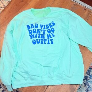 Mint Green Sweatshirt with Blue Text